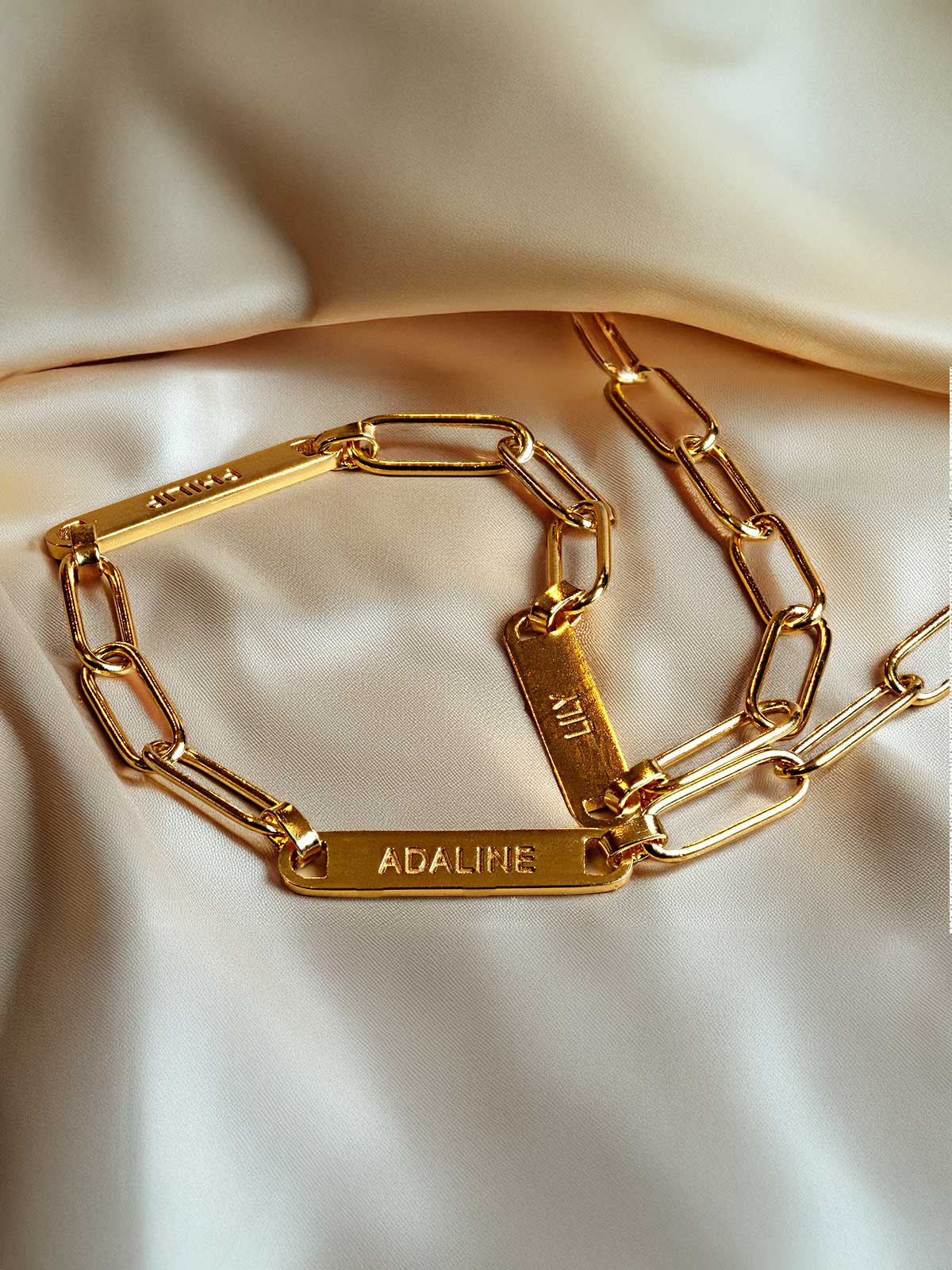 a close up of a gold chain bracelet