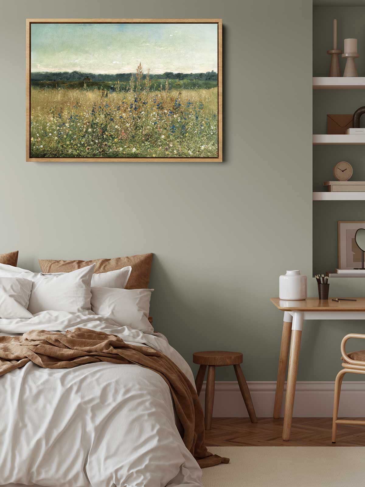 a serene bedroom scene with a large bed, a wooden table, and a painting of a field of flowers hanging on the wall.