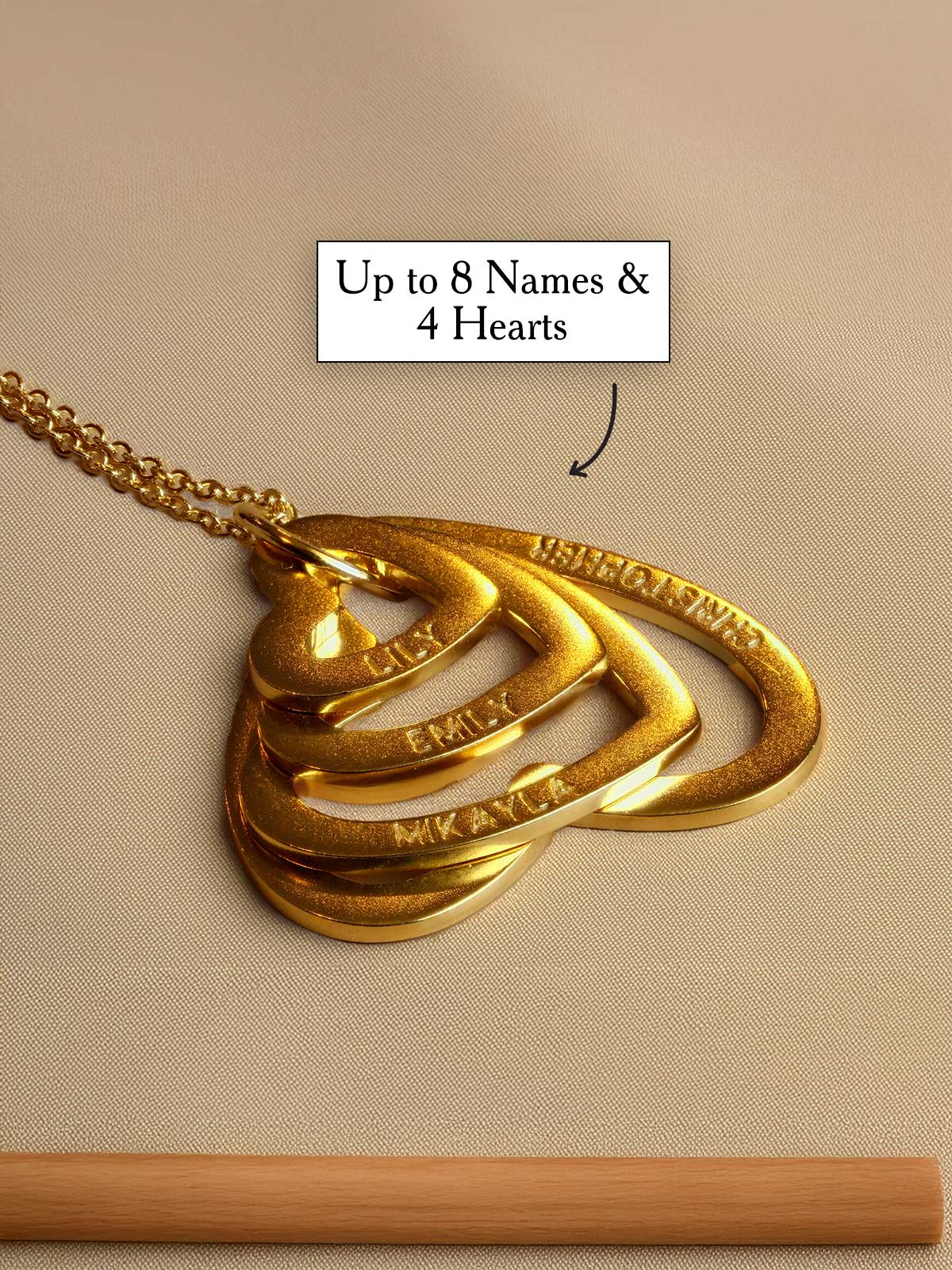 a gold necklace with the words up to 8 names and 4 hearts