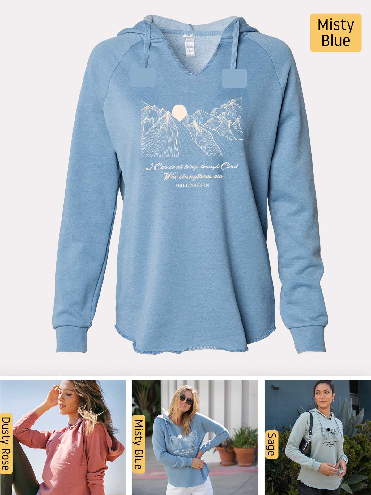 a woman wearing a blue sweatshirt with a mountain scene on it