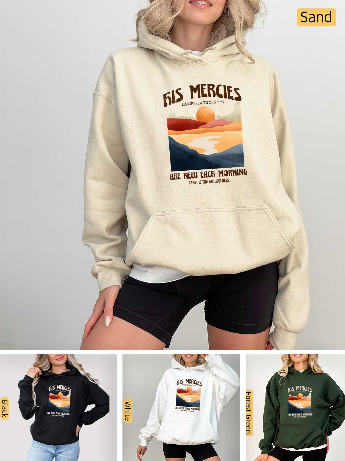 a woman wearing a sweatshirt with a picture of a sunset on it