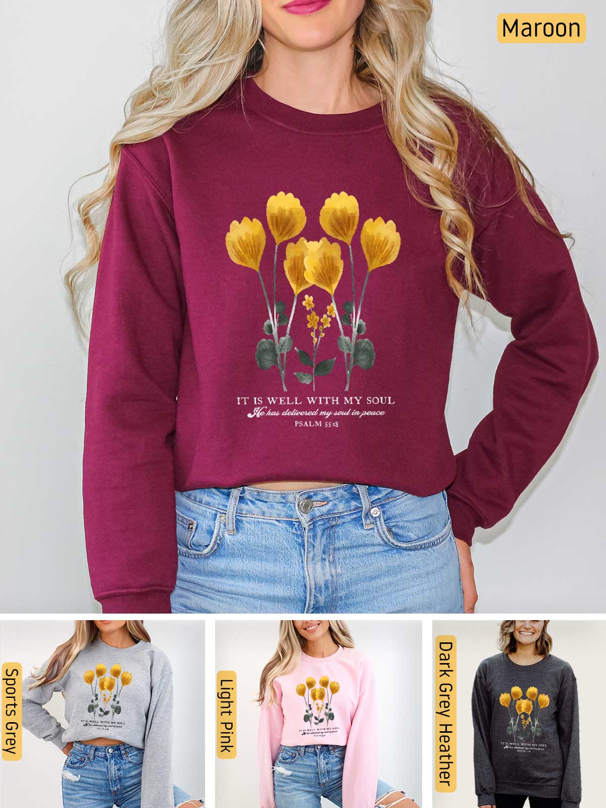 a woman wearing a maroon sweatshirt with yellow flowers on it