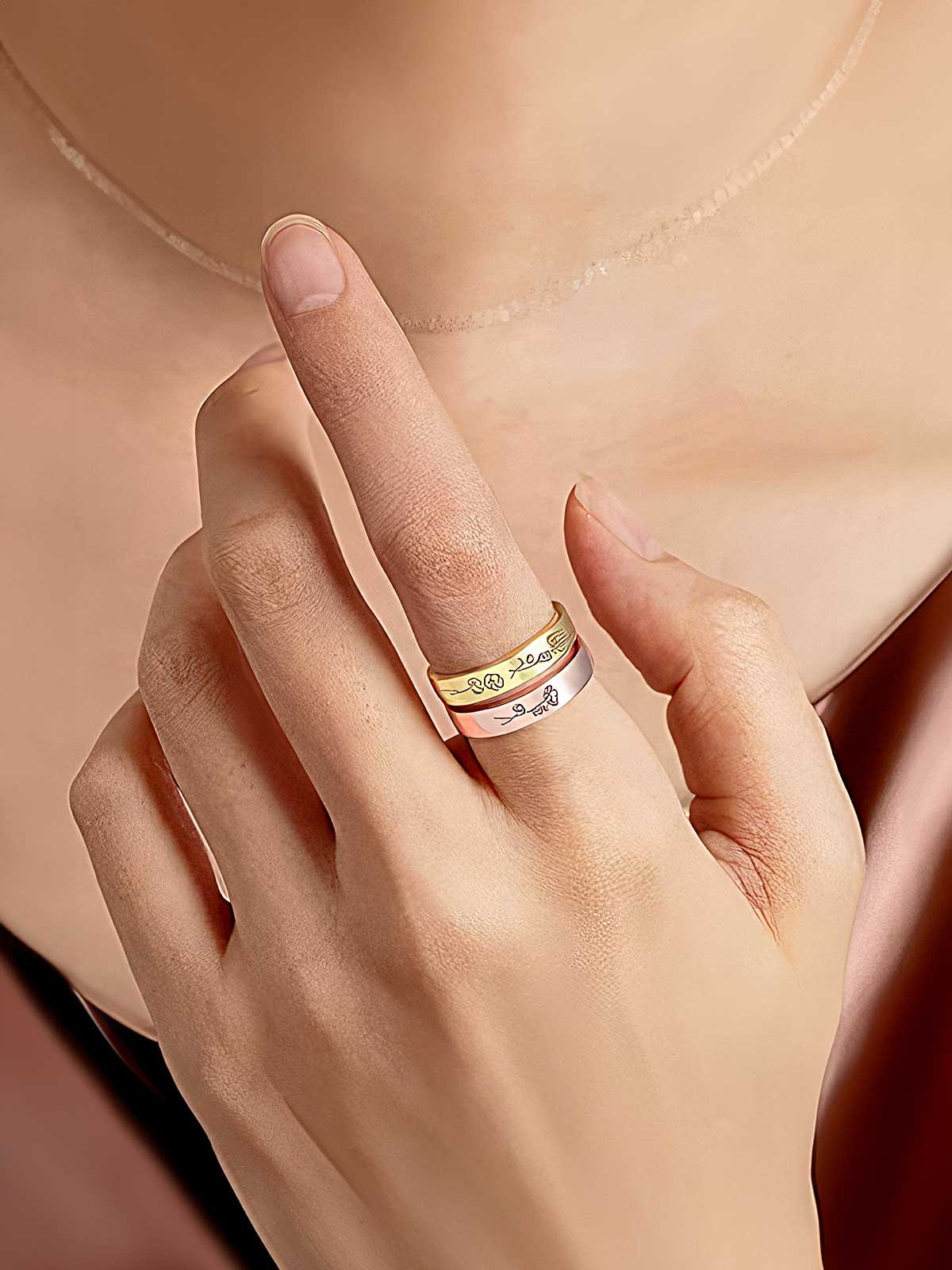 a woman's hand with a ring on it