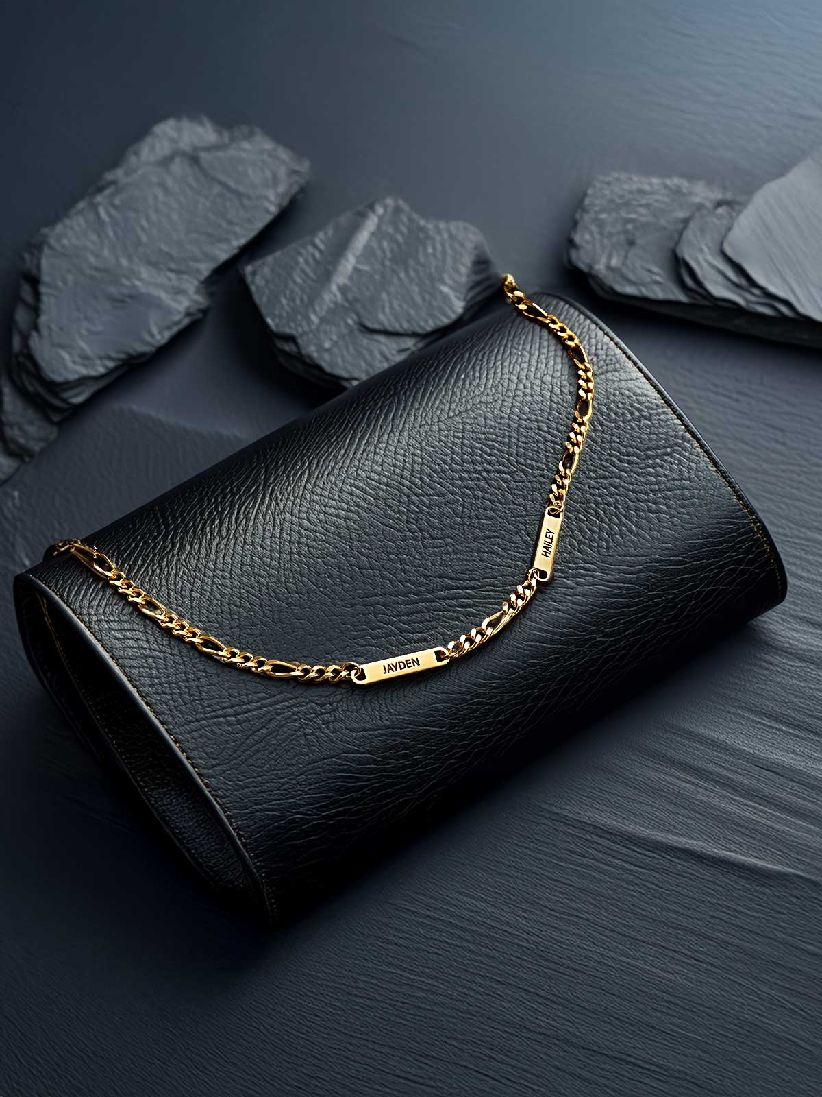 a black purse with a gold chain on it