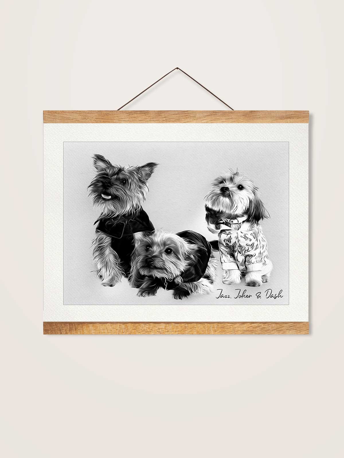 A black and white photograph of three dogs, including a small dog wearing a sweater, a larger dog wearing a bow tie, and a small dog wearing a patterned shirt, all sitting together.