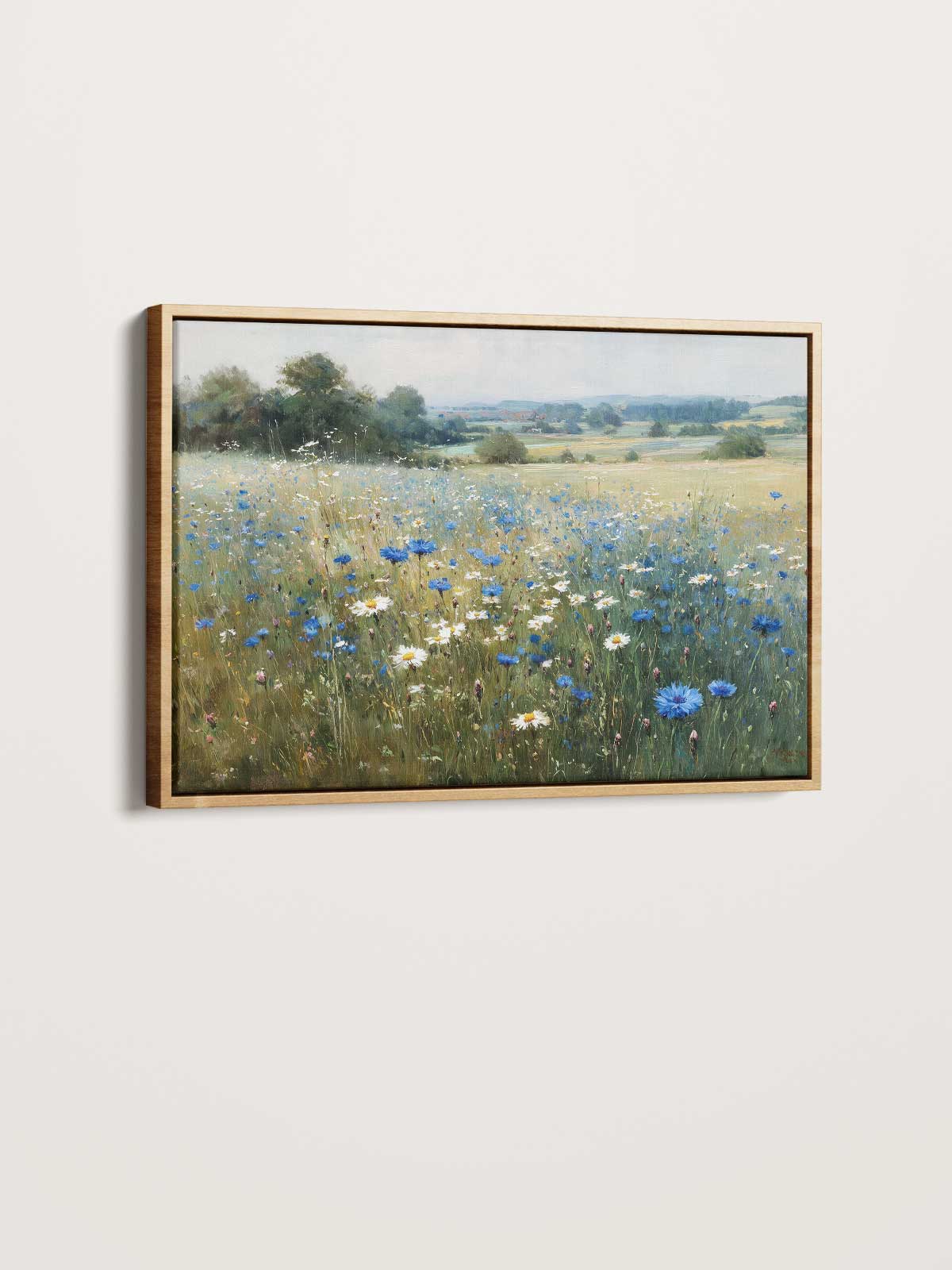 The image is a framed painting depicting a field of wildflowers, including blue and white flowers, against a backdrop of trees and a blue sky.