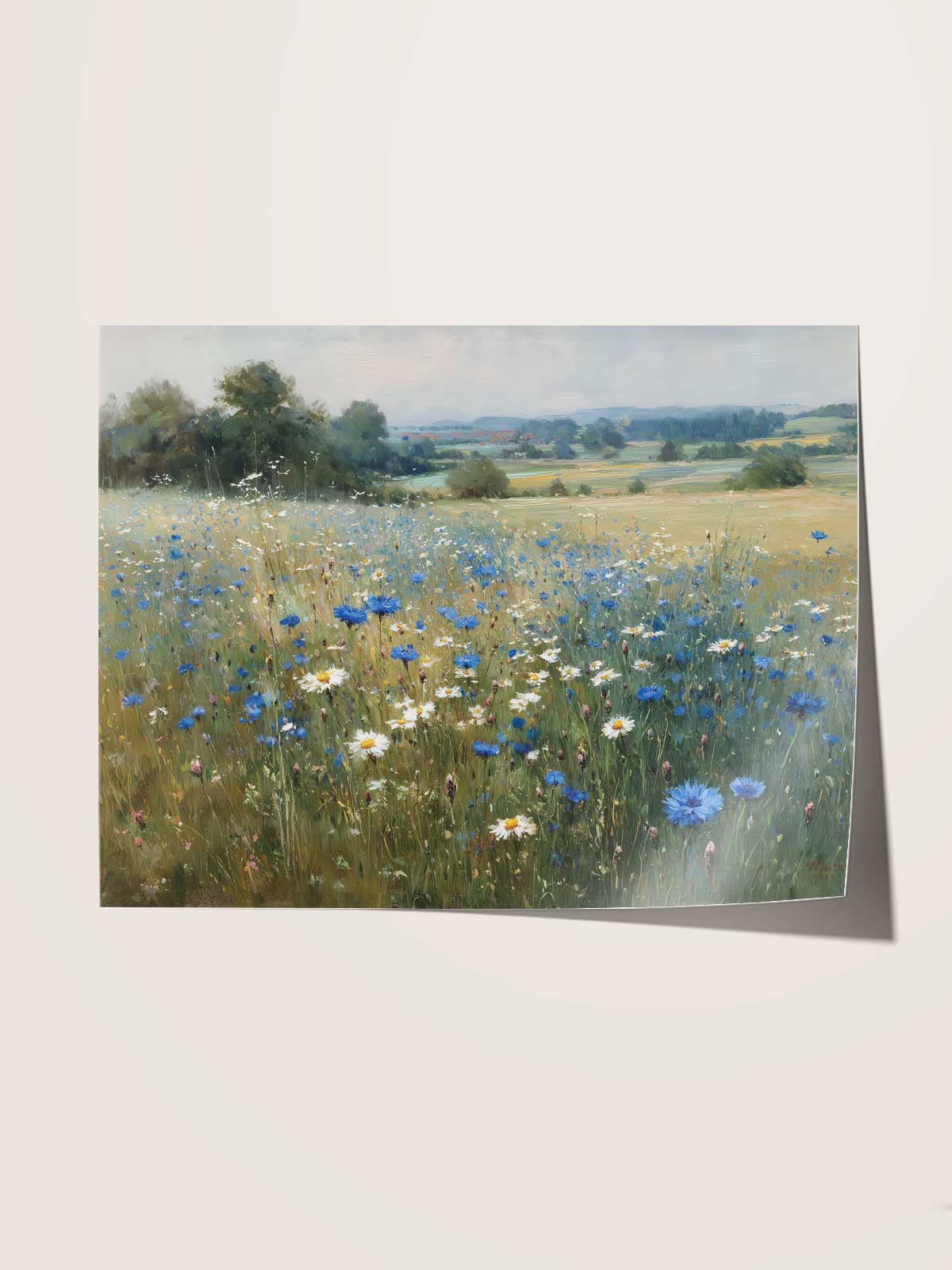 A field of wildflowers, including blue and white flowers, stretches out in the foreground of a serene landscape.