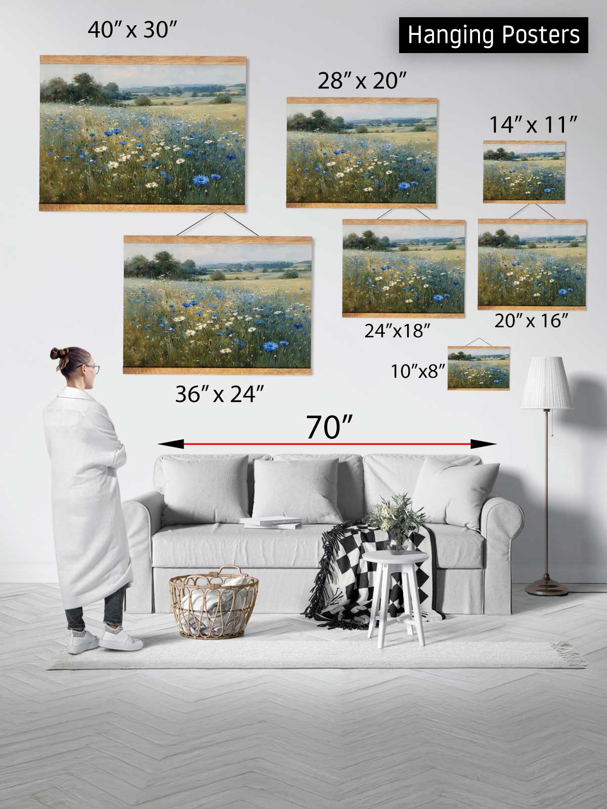 The image is a collage of various hanging posters of landscapes, including a pastoral scene with flowers and a field. The posters are of different sizes and dimensions, ranging from 40" x 30" to 70" x 24" in width. A person is standing in front of the collage, likely admiring the artwork.