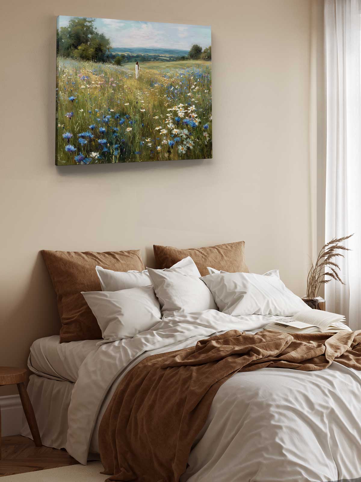 a serene bedroom scene with a bed adorned with white linens and brown throw pillows, and a painting of a field of flowers hanging above it.