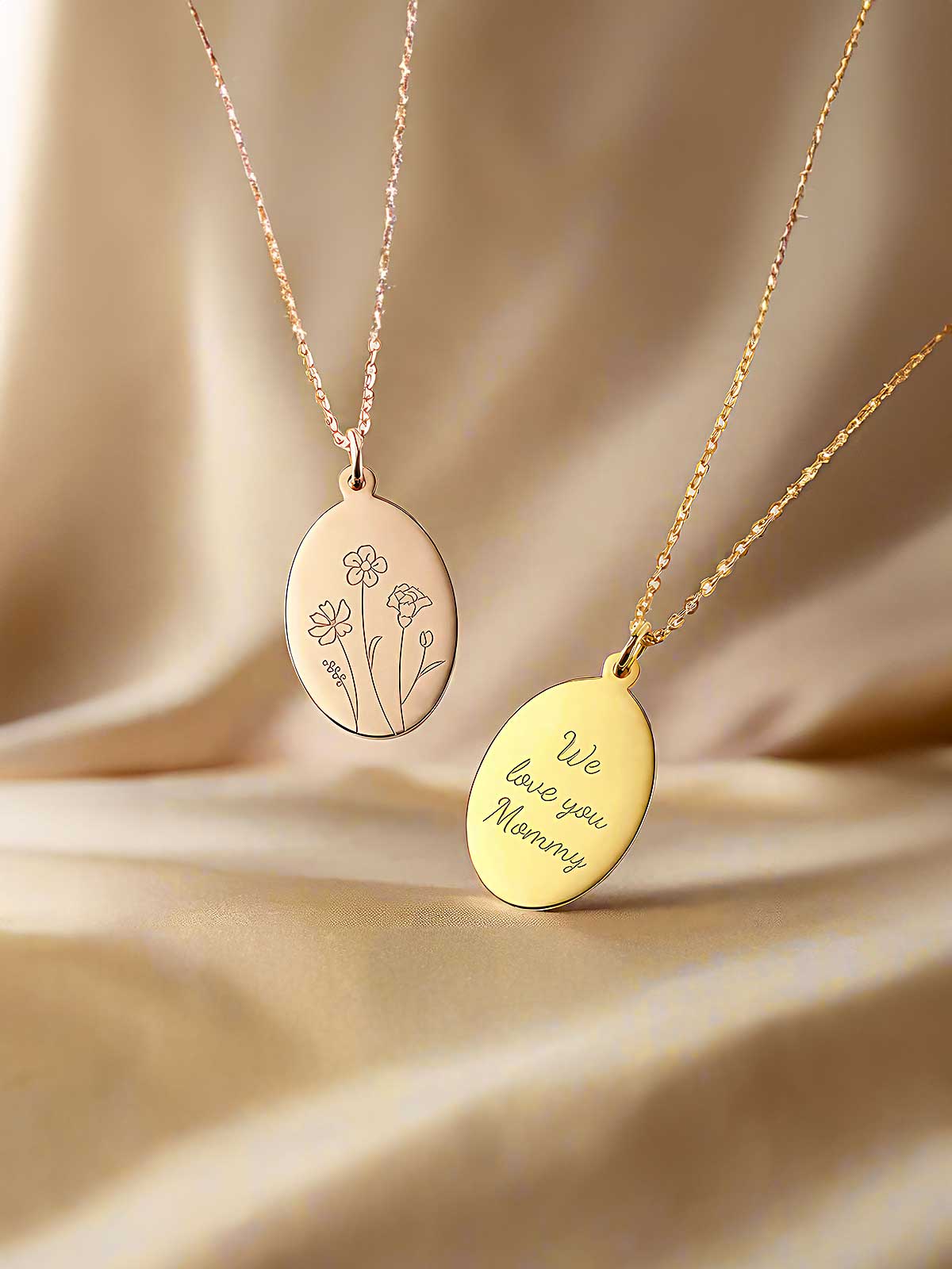 a couple of necklaces sitting on top of a table