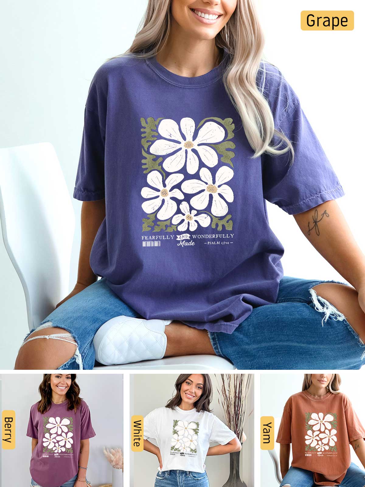 a woman sitting on a chair wearing a t - shirt with flowers on it