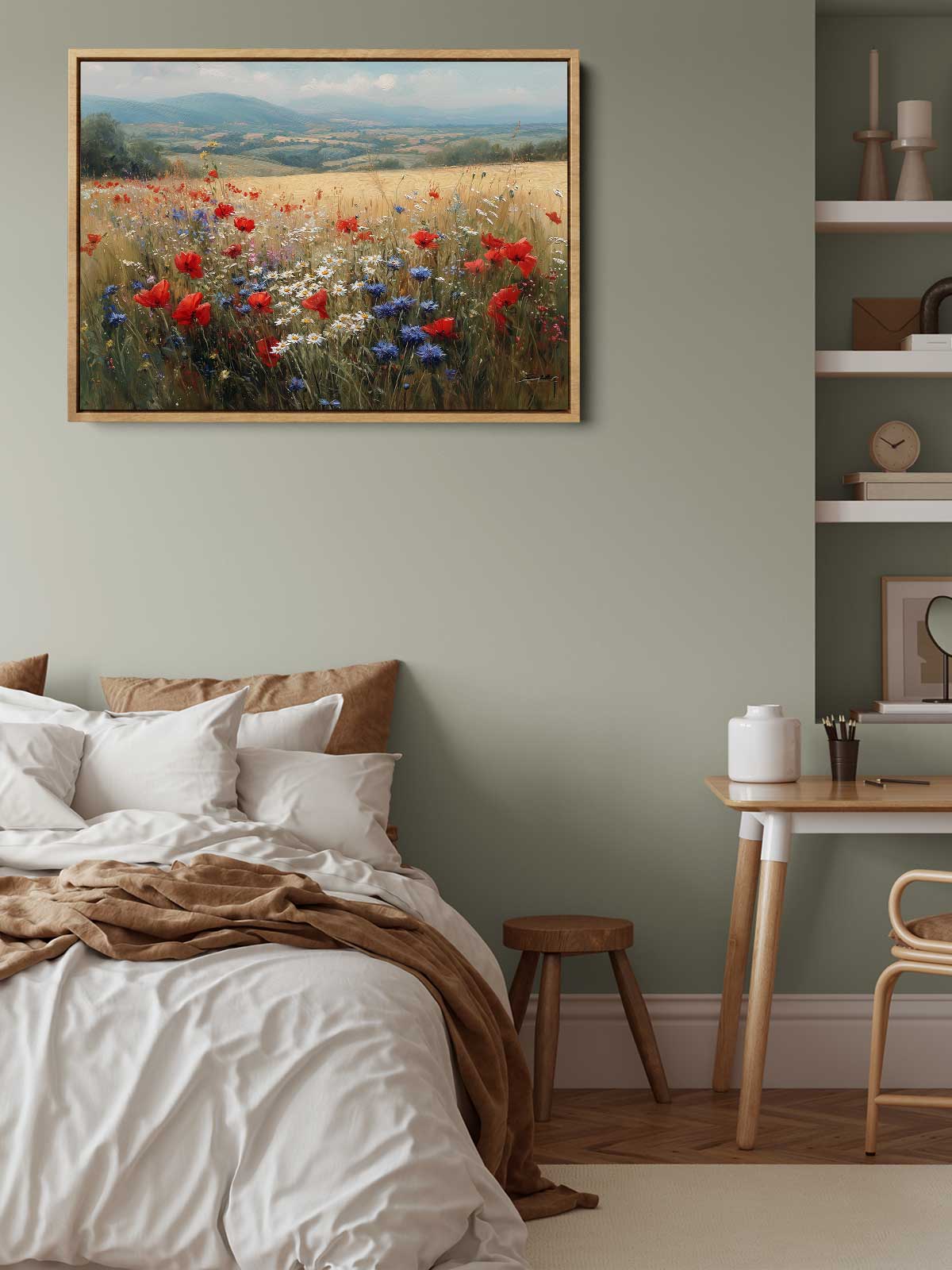 a serene bedroom scene with a bed, a wooden table, and a framed painting of a field of flowers hanging on the wall.