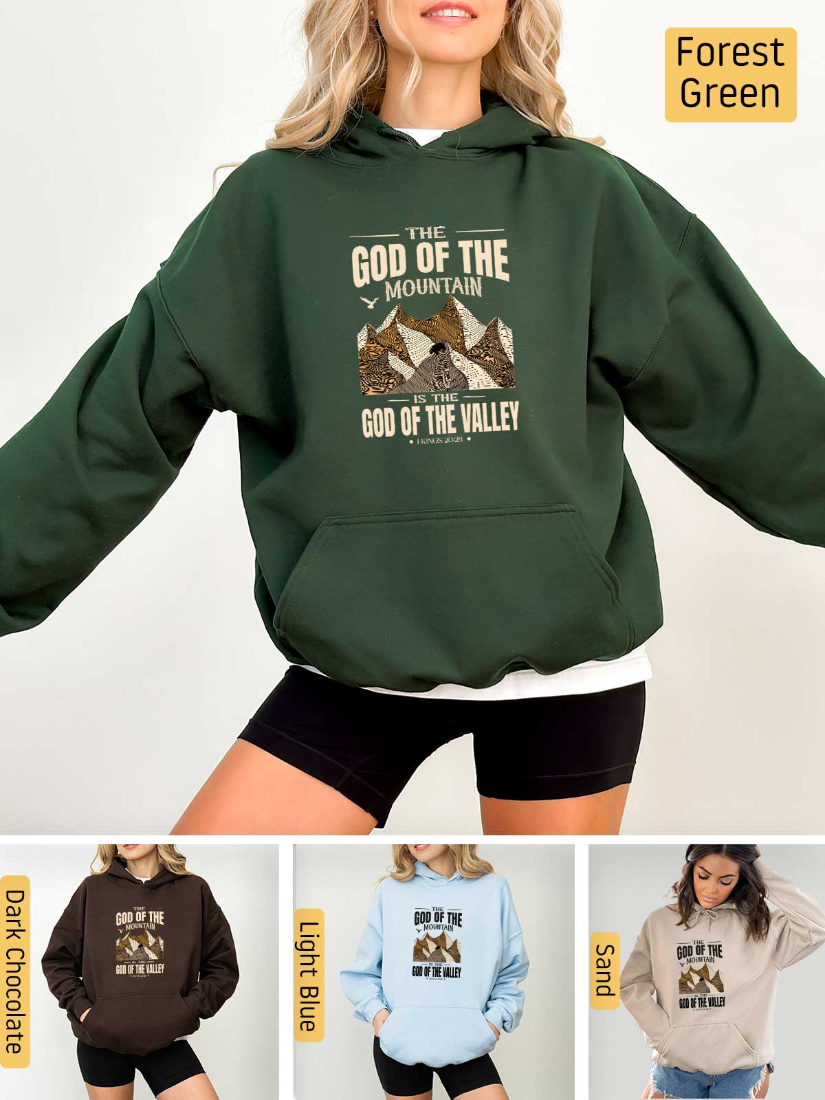 a woman wearing a hoodie with the words god of the mountains on it