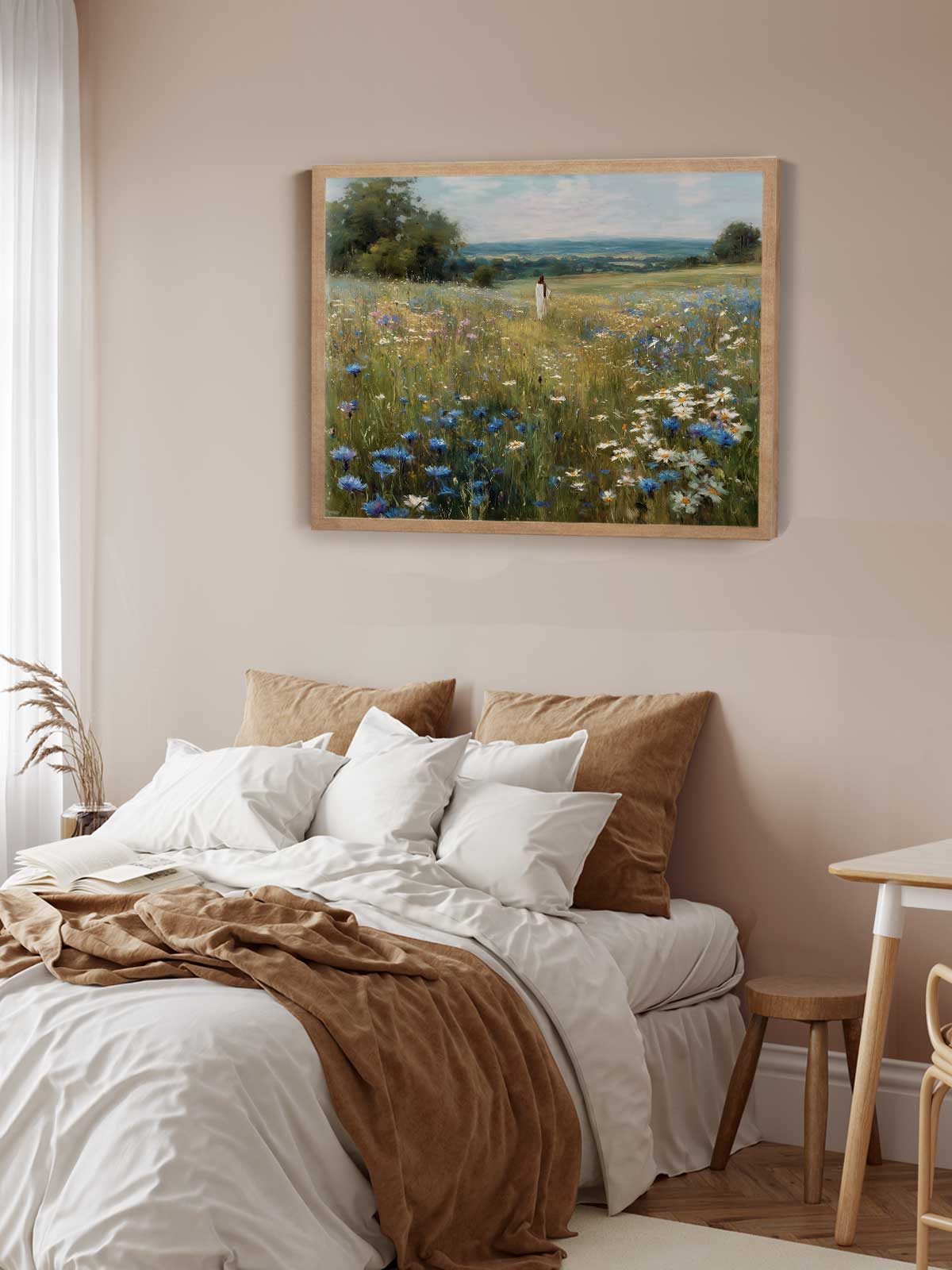 a serene bedroom scene with a bed adorned with white linens and brown throw pillows, a wooden nightstand, and a framed painting of a field of flowers hanging on the wall above the bed.