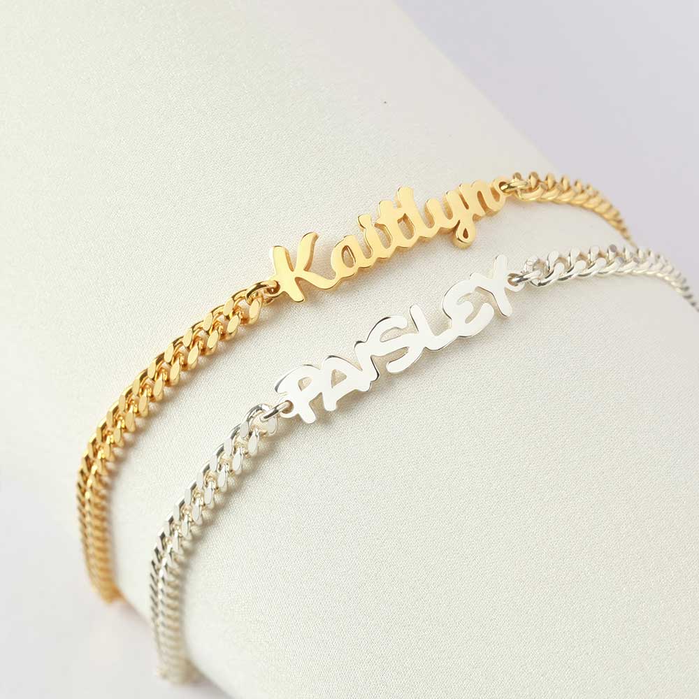 two personalized bracelets on a white surface