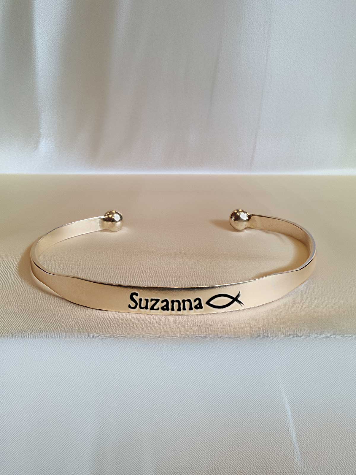 a gold bracelet with a name on it