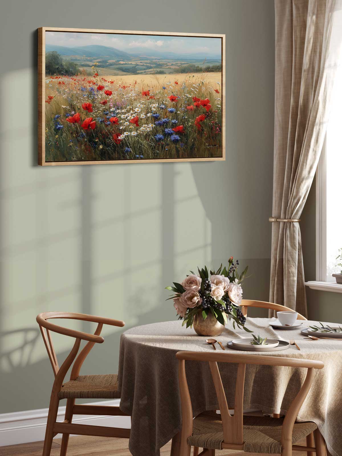 a dining room with a table set for two, a vase of flowers, and a framed painting of a field of flowers hanging on the wall above the table.