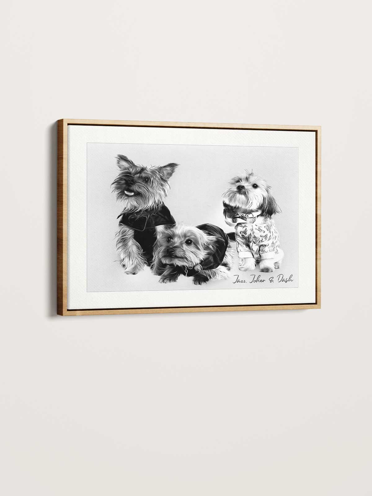 A black and white photograph of three dogs of different breeds, including a small dog, a medium-sized dog, and a larger dog, all sitting together.