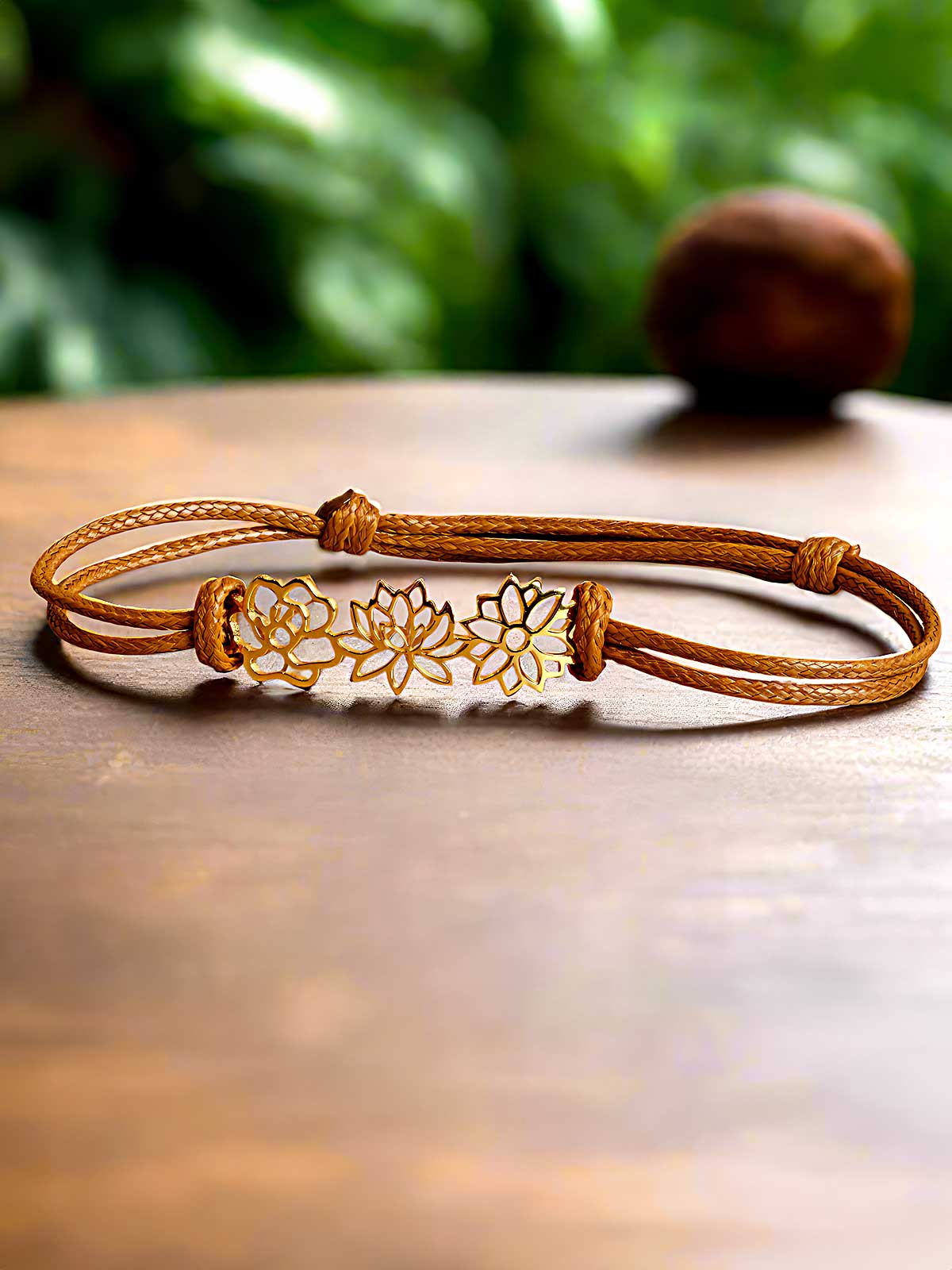 a close up of a bracelet on a table