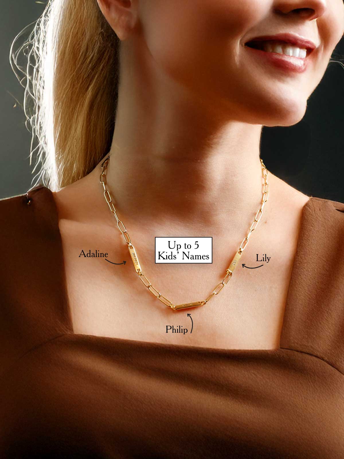 a woman wearing a necklace with a name tag on it