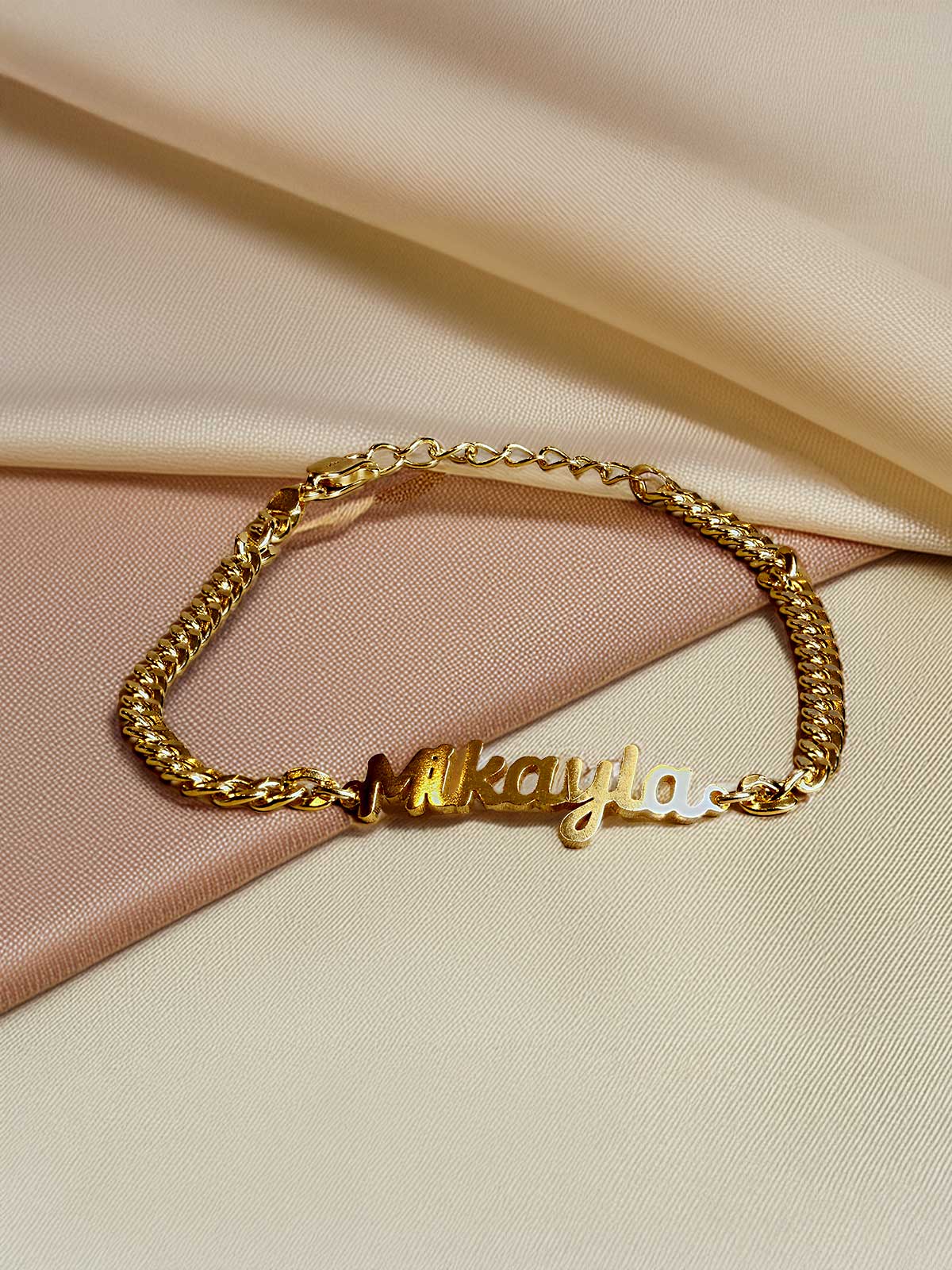 a gold bracelet with a name on it