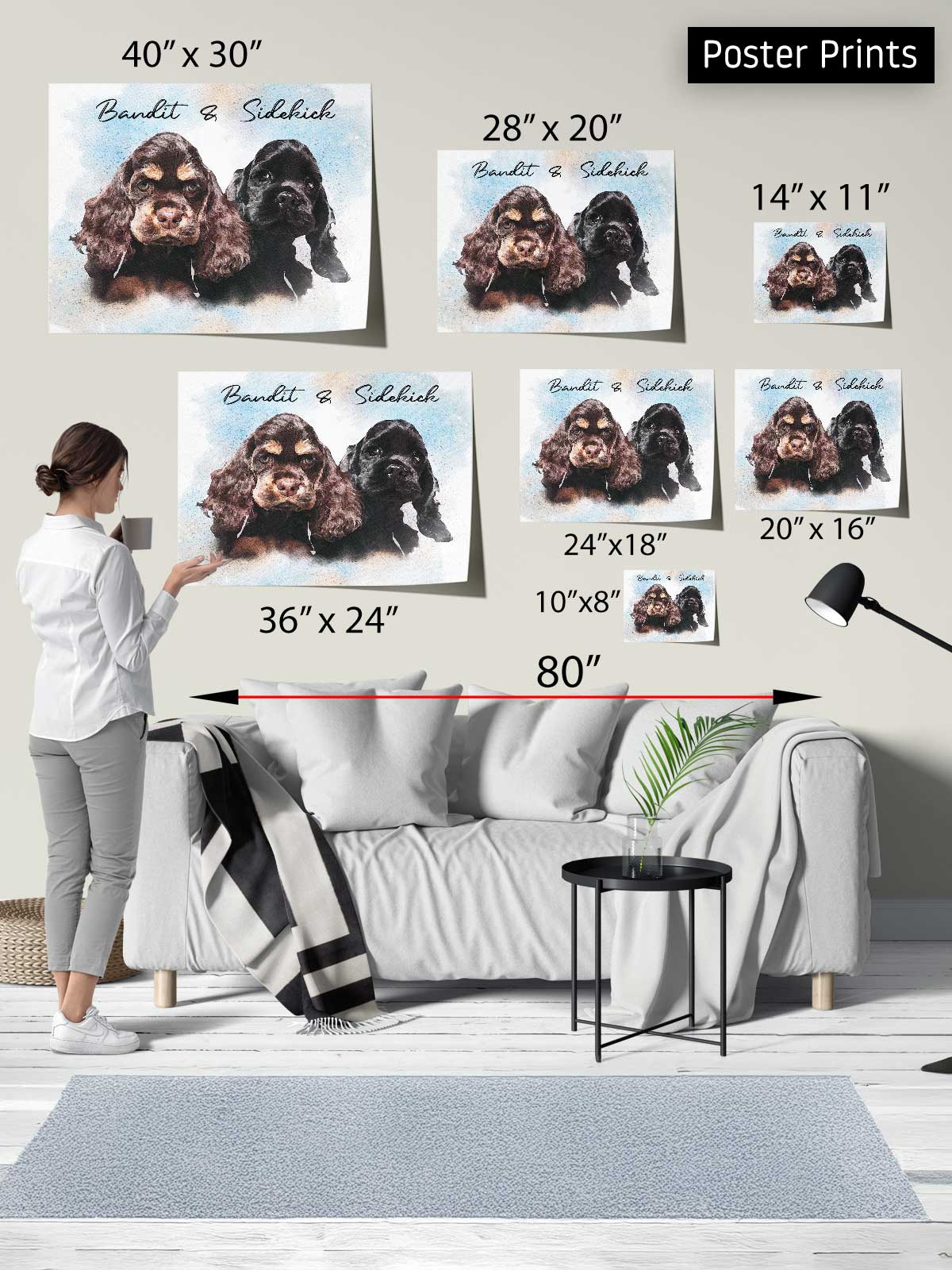 The image is a poster print display featuring a woman standing in front of a gray couch, with various sizes of posters of dogs displayed above her.