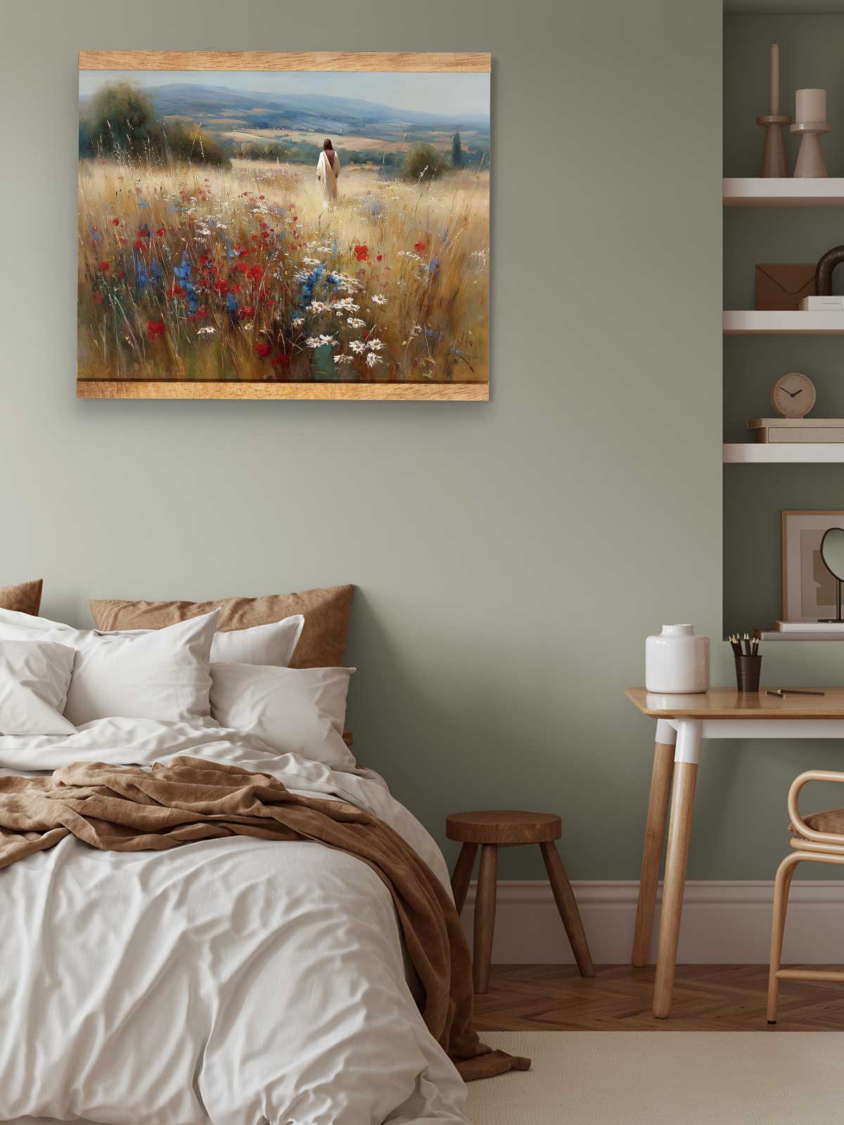 a serene bedroom scene with a bed, a wooden table, and a painting of a field with flowers hanging on the wall.