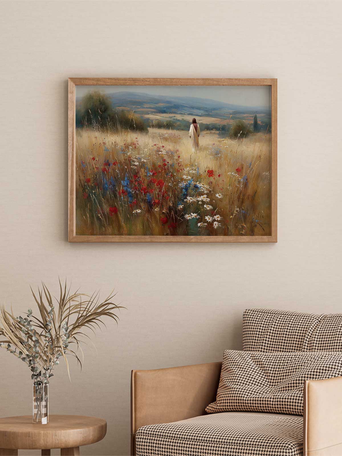 a framed painting of a person walking through a field of flowers, with a wooden chair and a small table with a vase of flowers in the foreground.