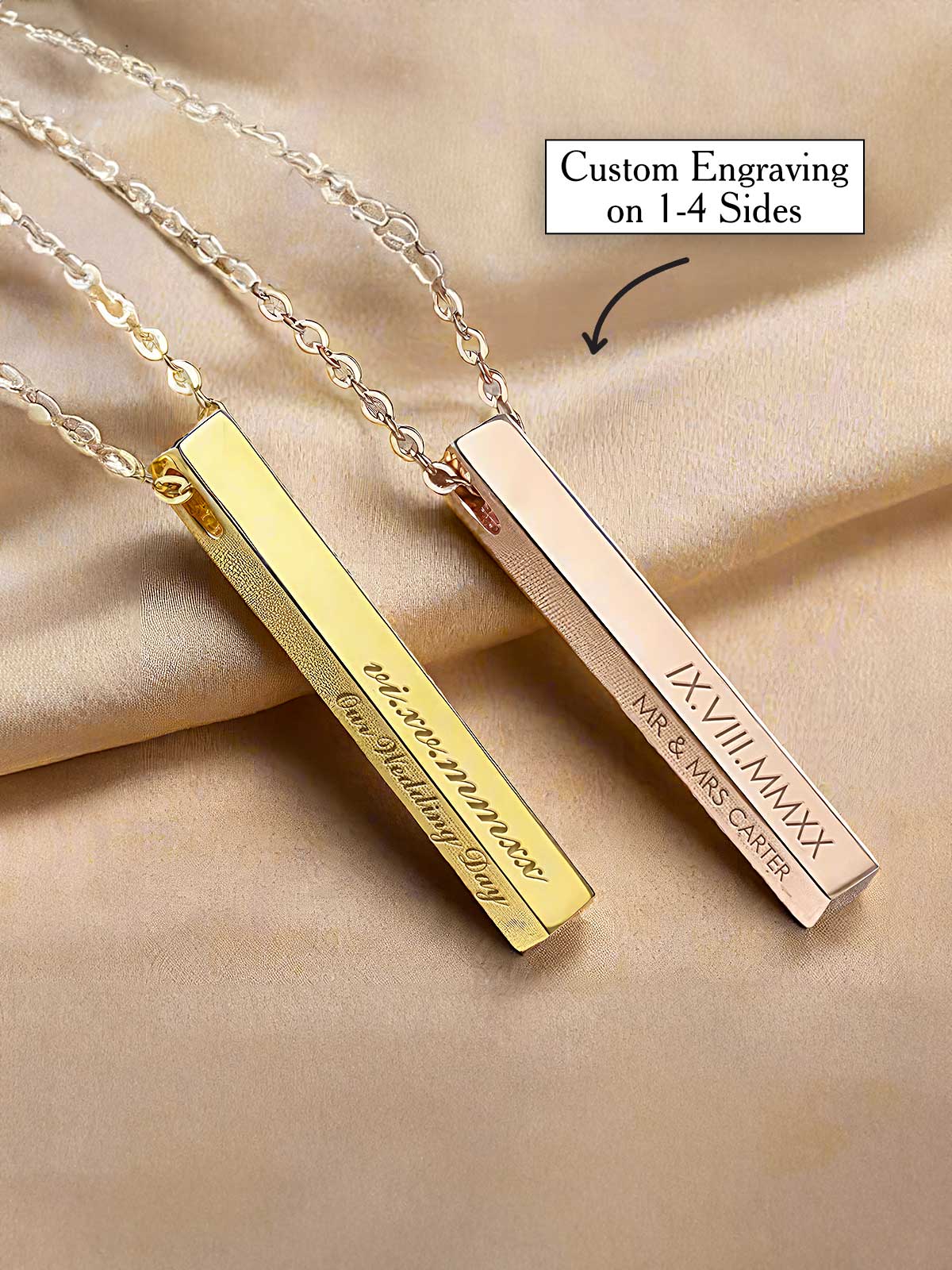 a couple of gold bar necklaces with engraving on them