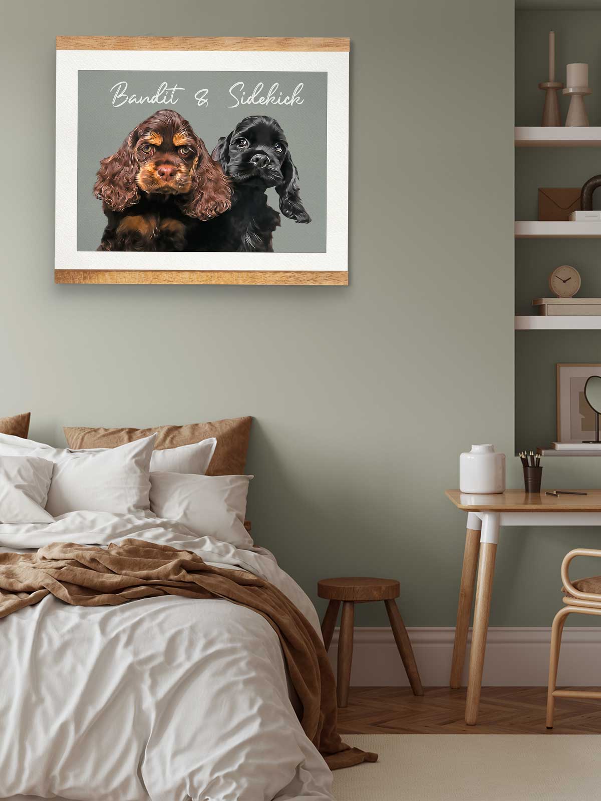 two dogs, one black and one brown, sitting together in a framed artwork on a wall above a bed.