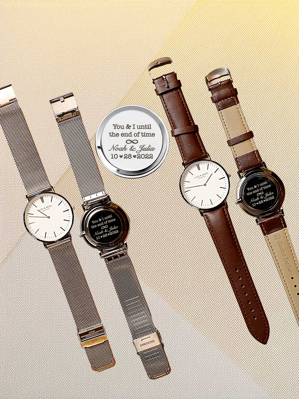 a group of four watches sitting next to each other