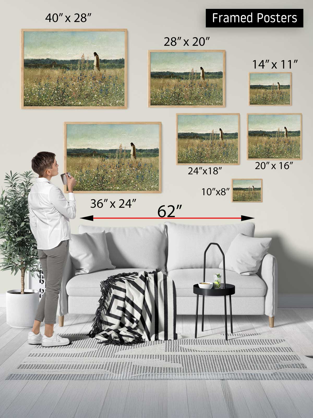 The image is a collage of framed posters of various sizes, including a large painting of a field and smaller paintings of people and landscapes. A person is standing in front of the collage, looking at the different framed posters.