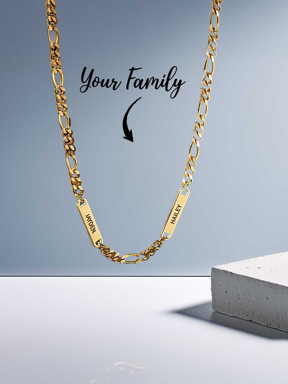 a gold chain with a name tag on it