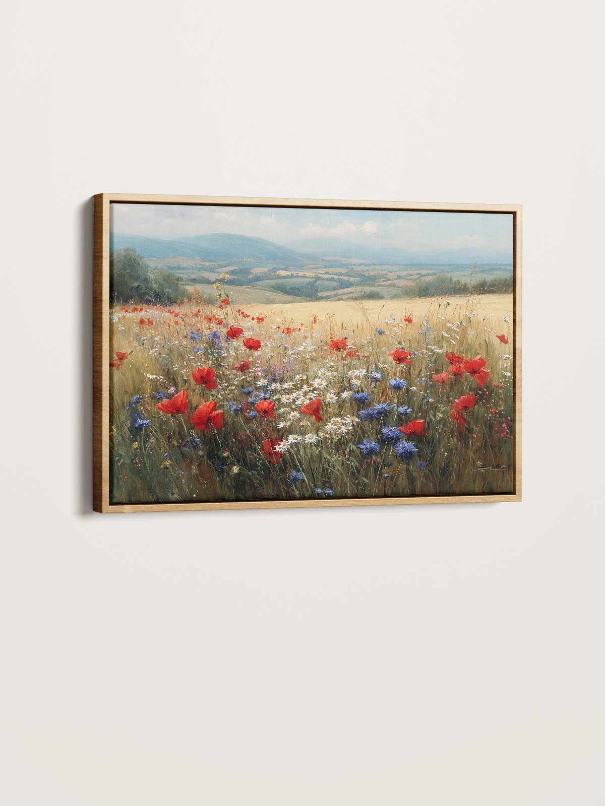 The image is a framed painting depicting a vibrant field of red poppies and blue and white flowers against a backdrop of rolling hills and a cloudy sky.