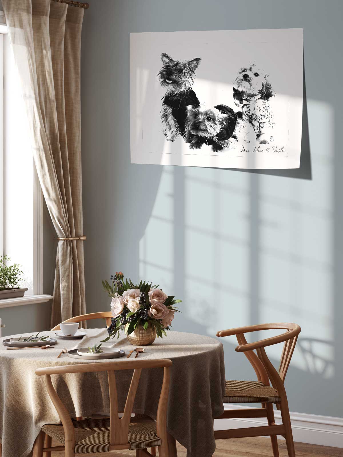 a dining room with a table set for two, featuring a vase of flowers and a framed drawing of dogs on the wall above the table.