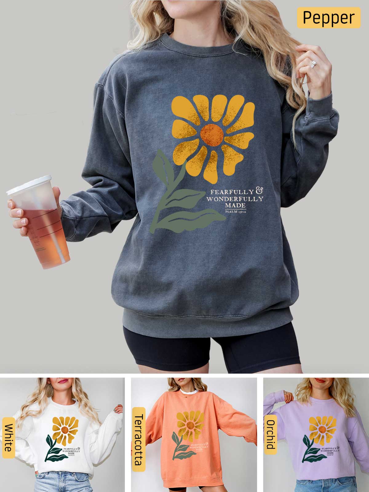 a woman wearing a sweatshirt with a flower on it