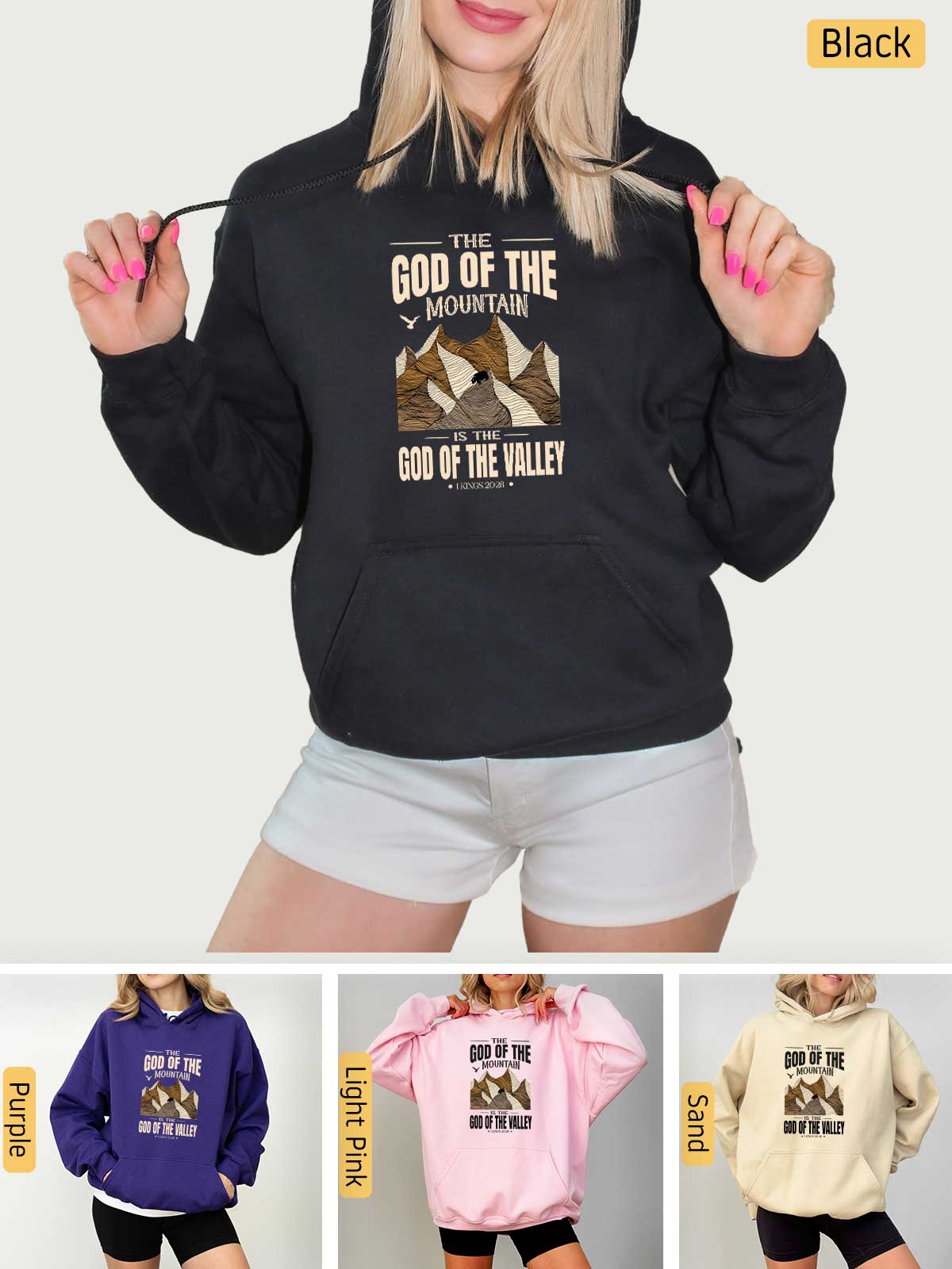 a woman wearing a hoodie and shorts with the words god of the mountains on