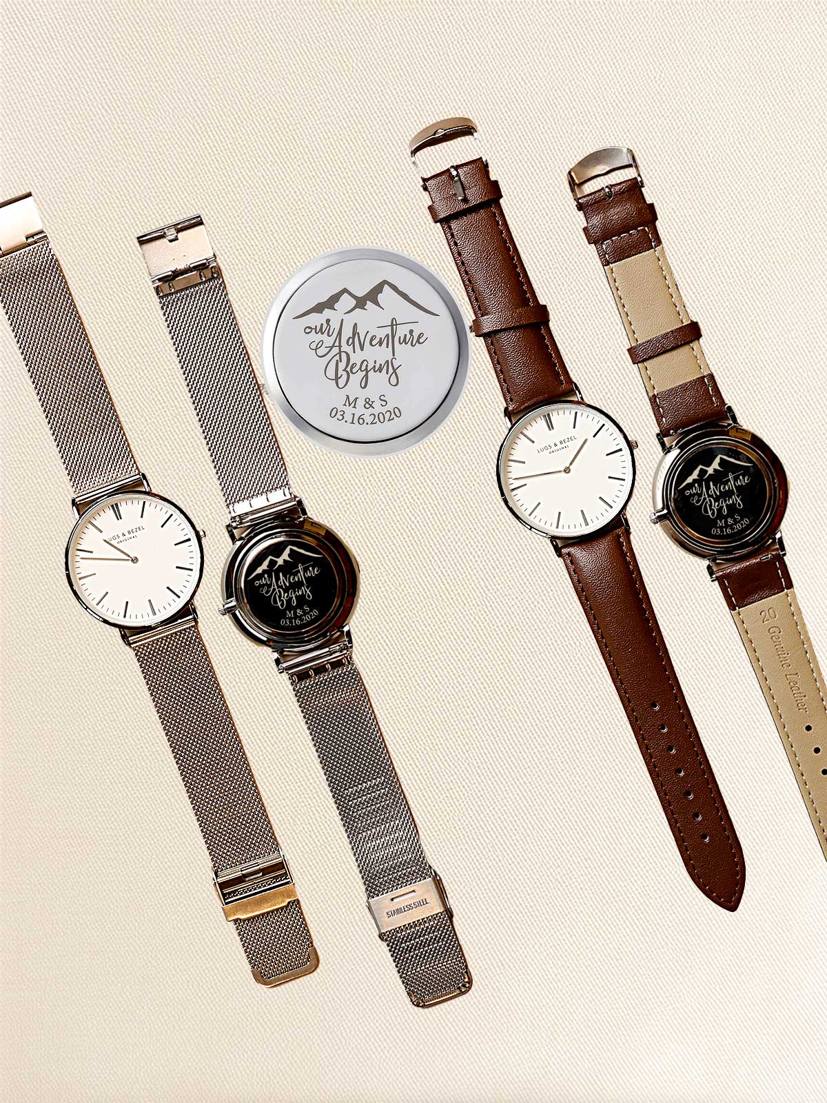 a group of four watches sitting next to each other