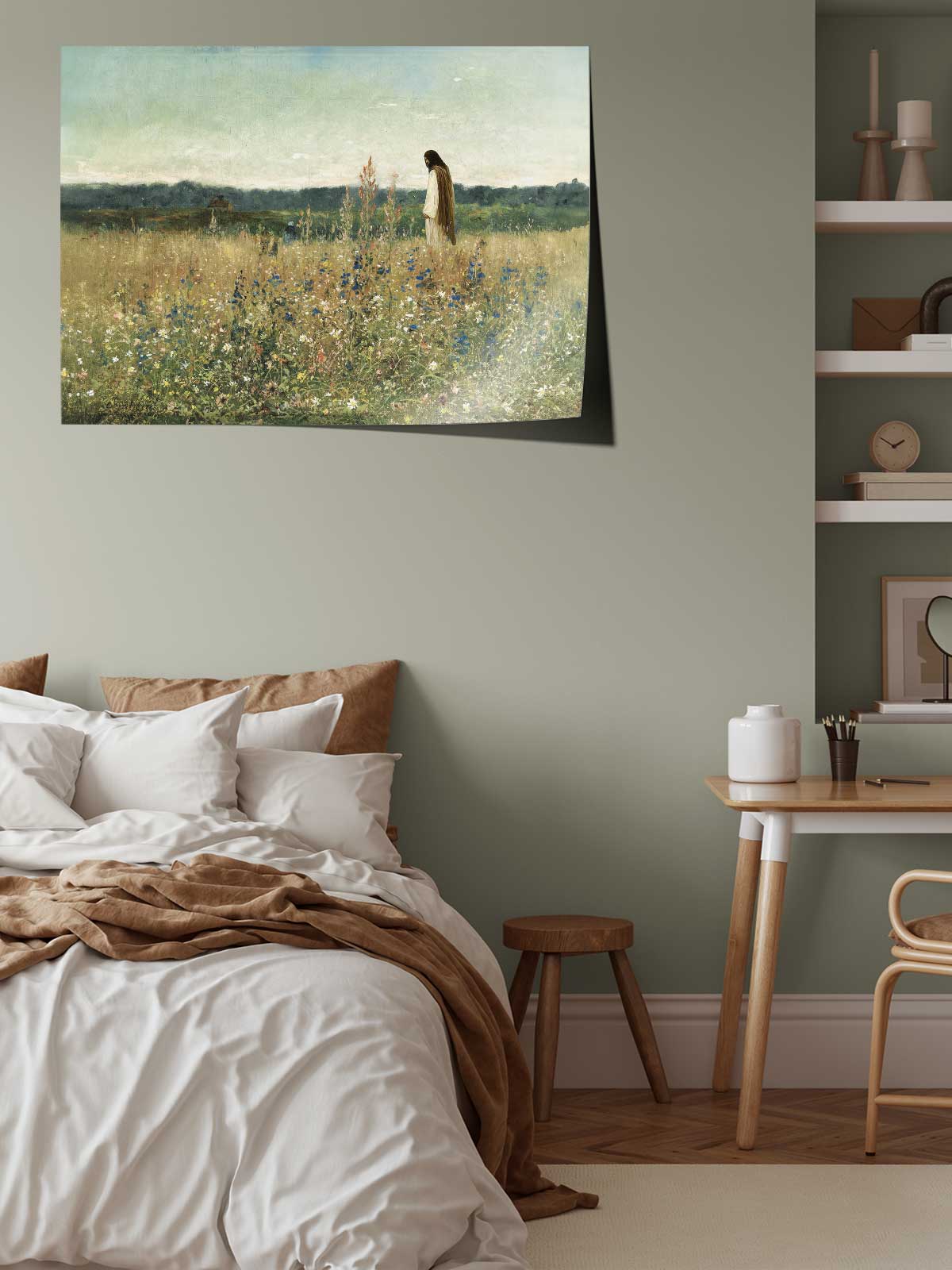 a serene bedroom scene with a bed, a wooden table, and a painting of a field with a person standing in the distance.