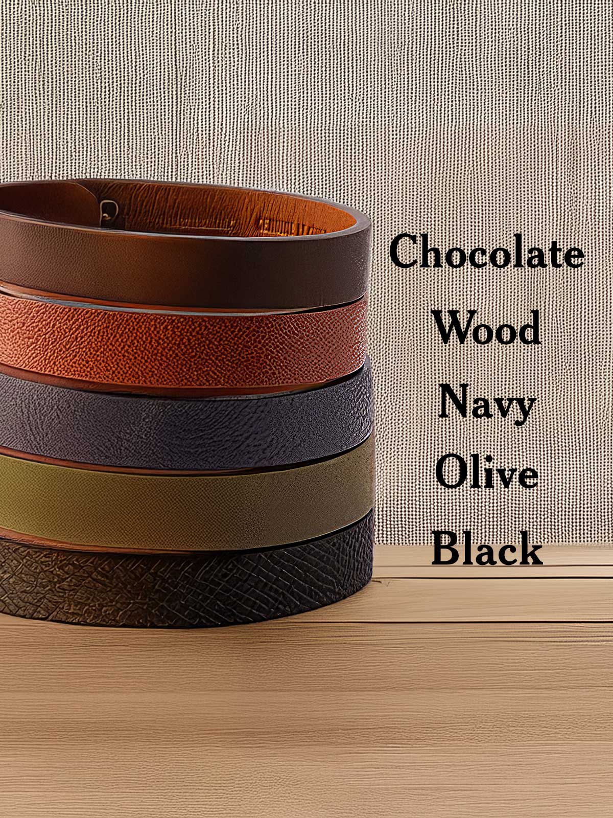 a stack of belts sitting on top of a wooden table