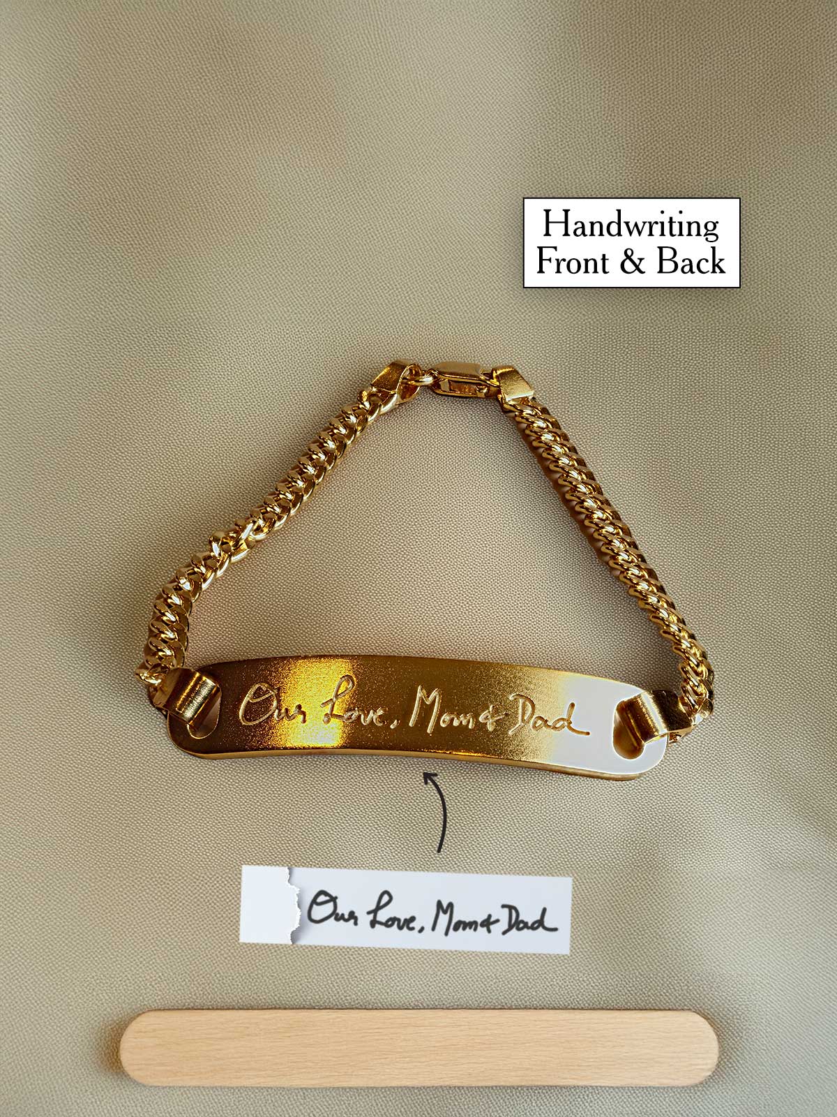 a gold bracelet with a name tag attached to it