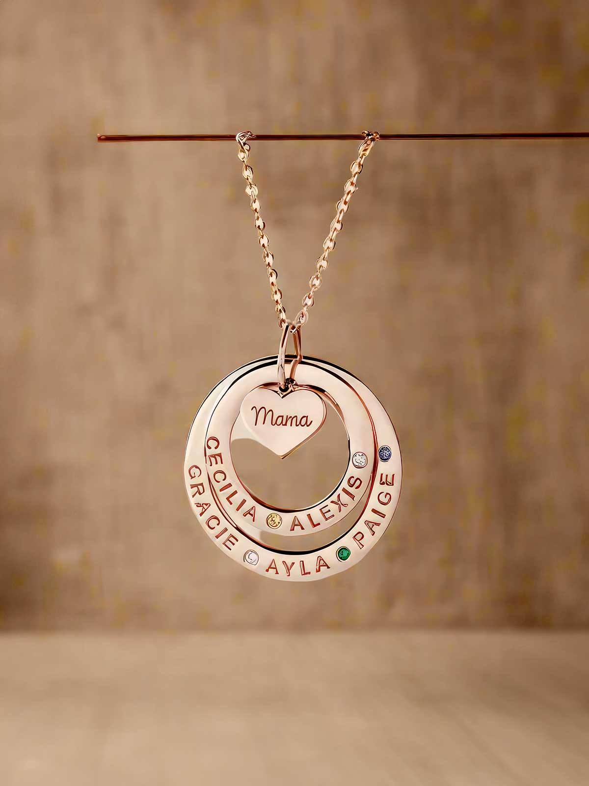 a necklace with a name and two circles on it