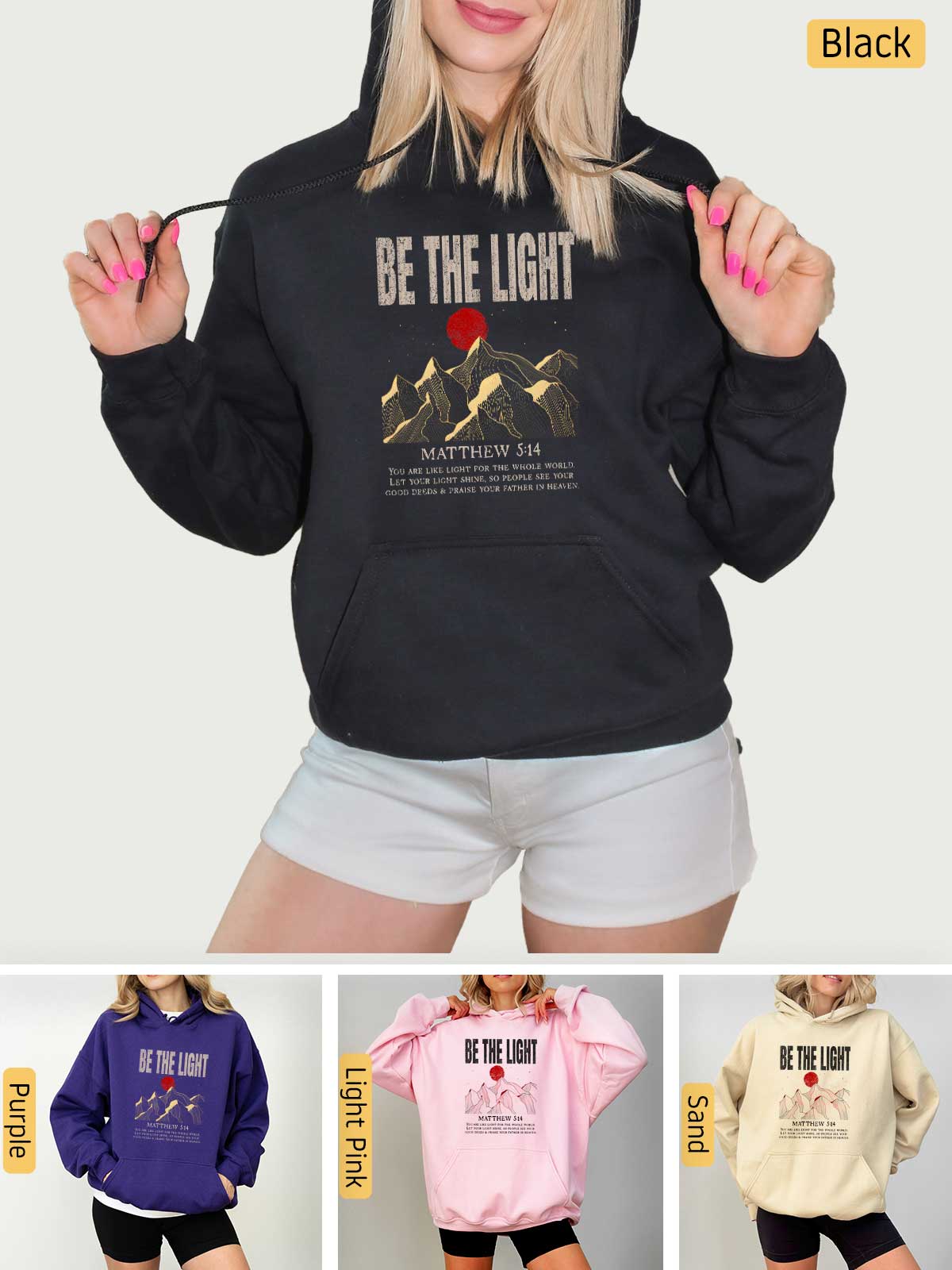 a woman wearing a hoodie and shorts with the words be the light on it