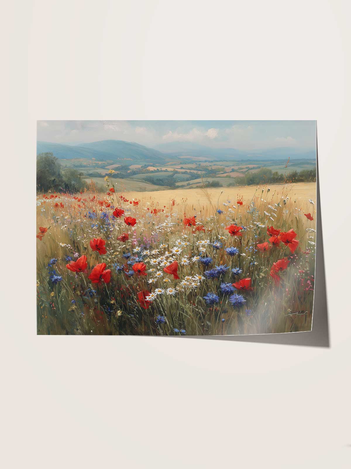 A vibrant field of red poppies and blue and white flowers stretches out under a clear blue sky, with rolling hills in the distance.