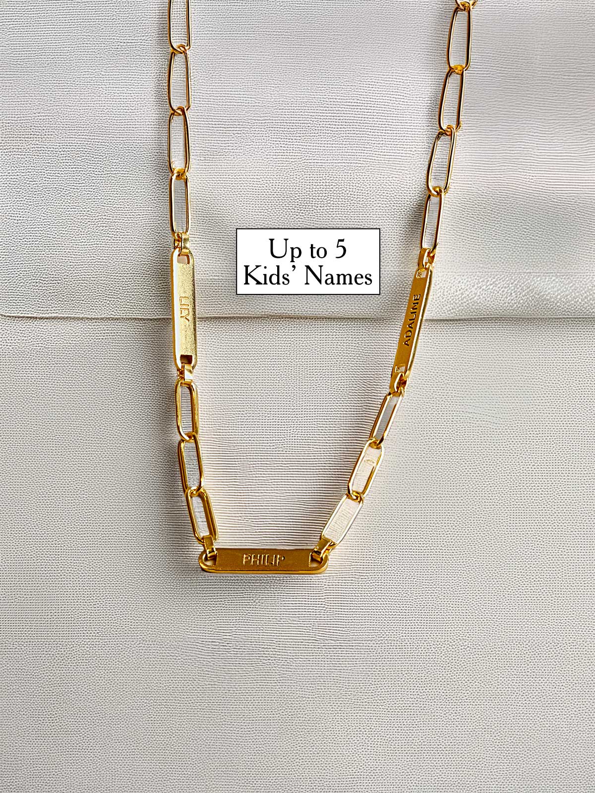 a close up of a chain with a name tag on it