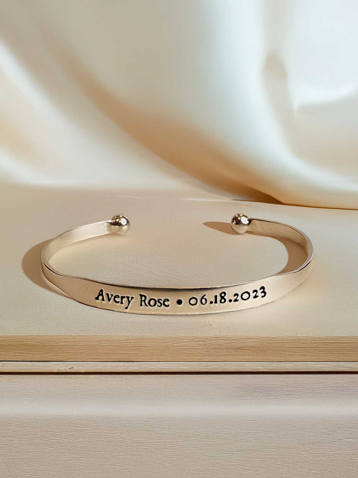 a silver bracelet with a message on it