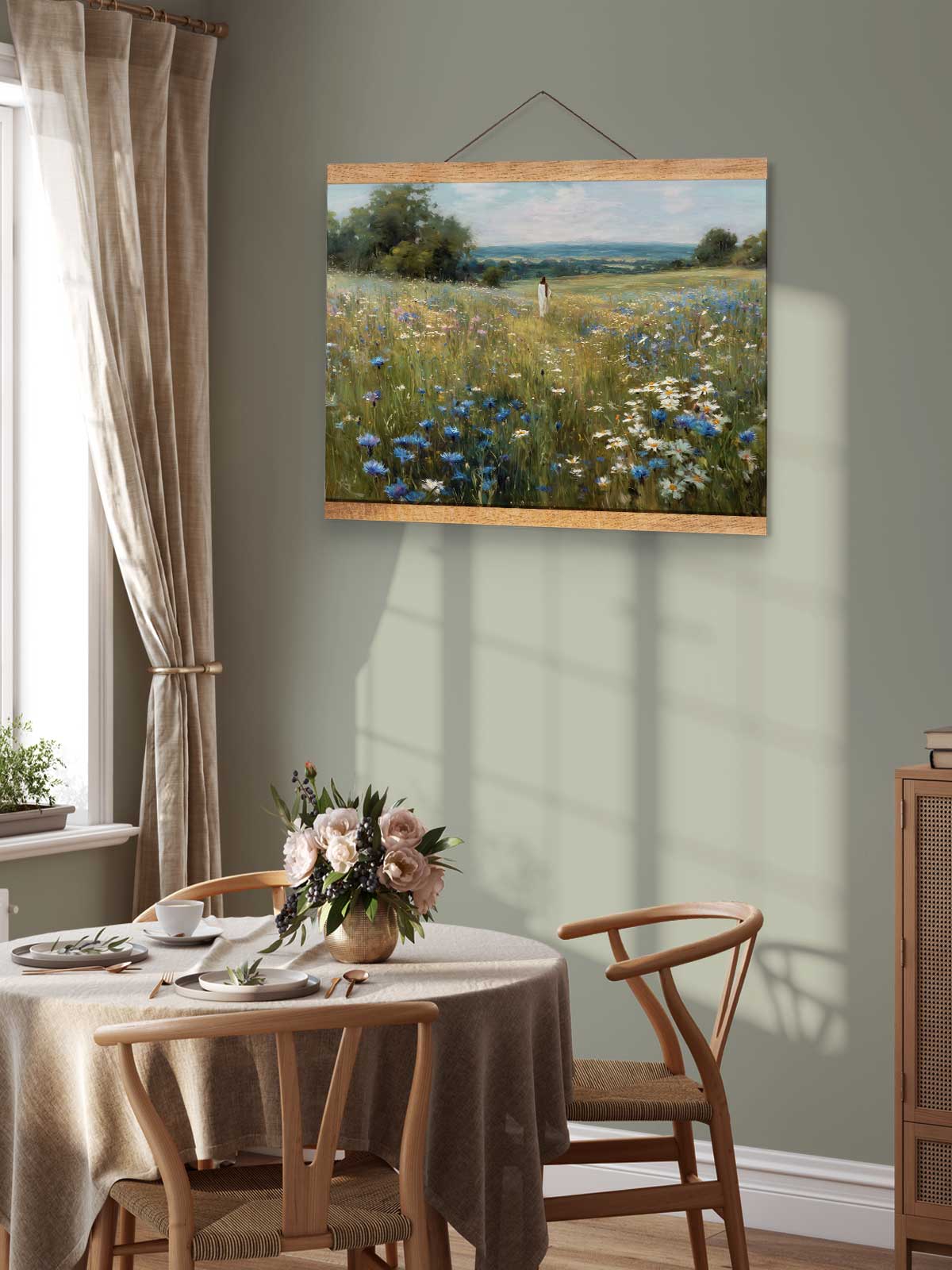 a serene dining room with a table set for two, featuring a vase of flowers and a painting of a field of flowers hanging on the wall above the table.