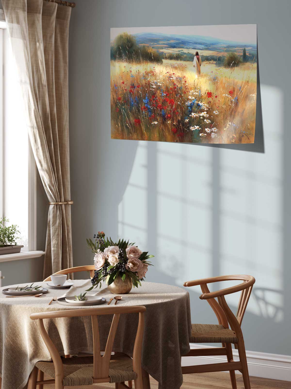 a serene dining room with a table set for two, featuring a vase of flowers and a painting of a woman walking through a field of flowers hanging on the wall above the table.