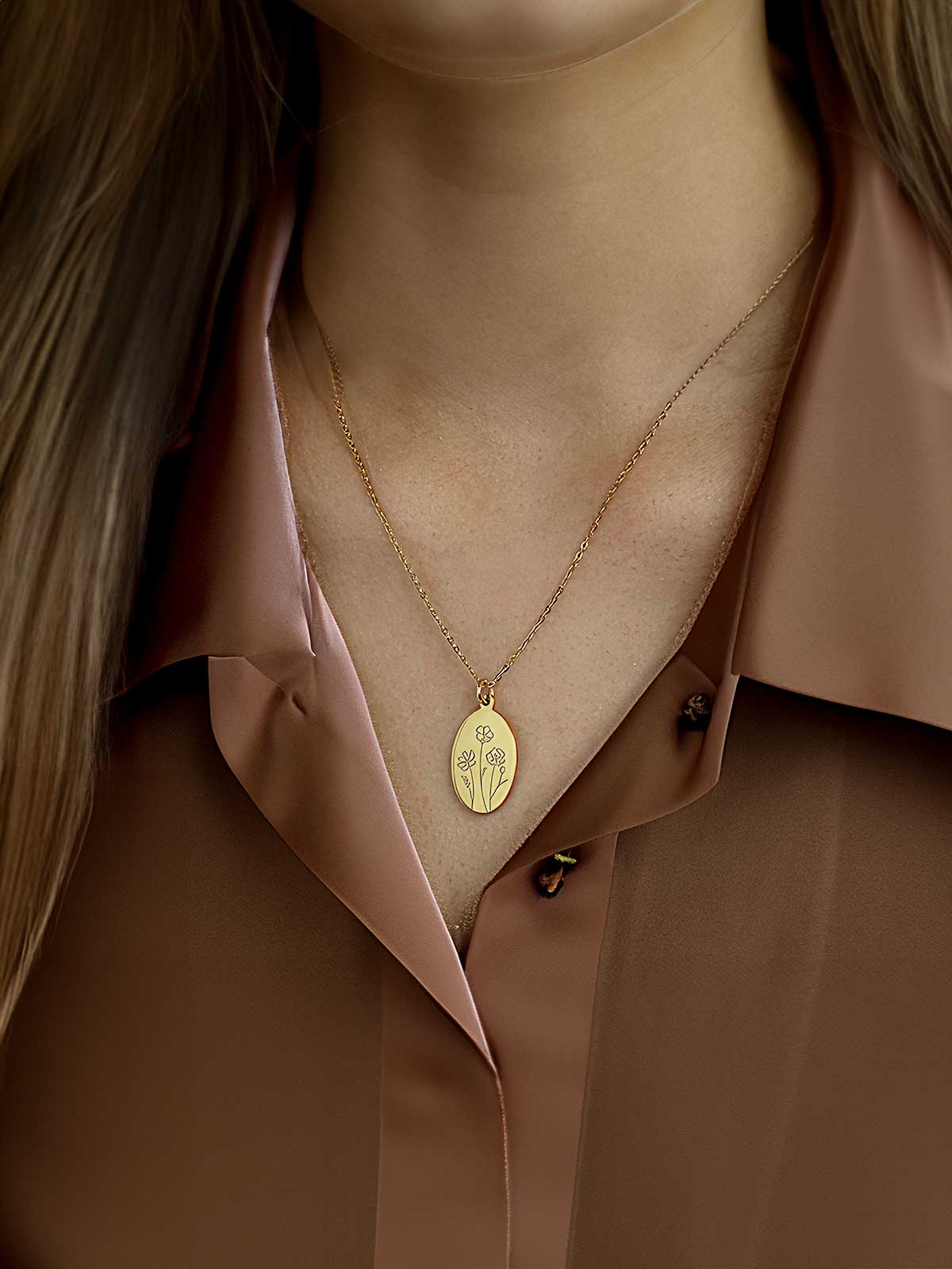 a close up of a woman wearing a gold necklace