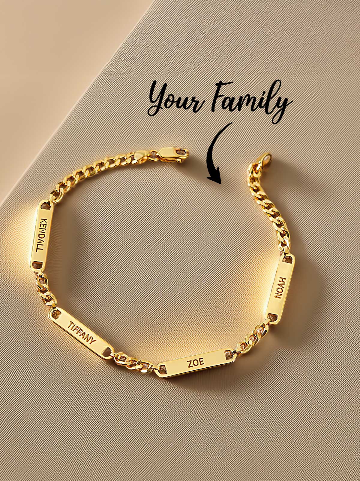a gold bracelet with a name engraved on it